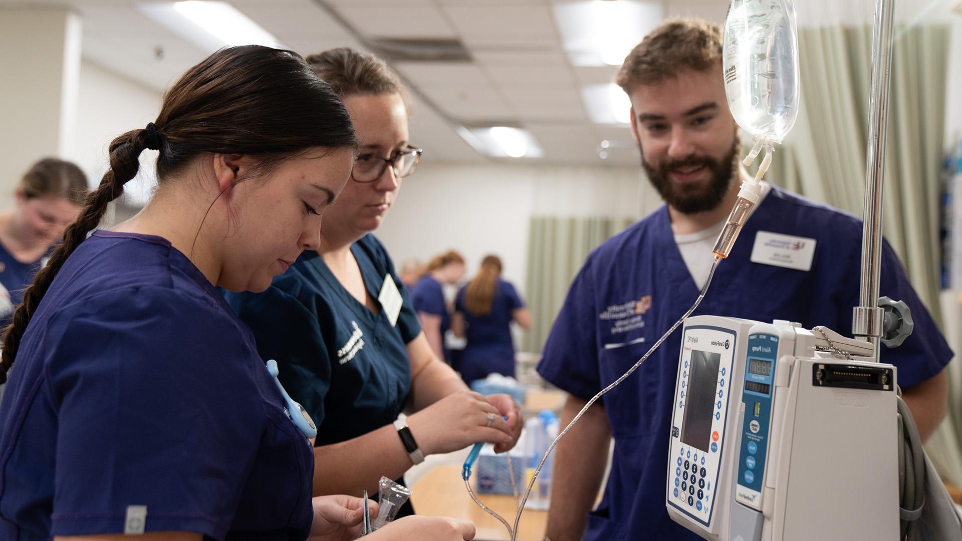 Nursing students with equipment